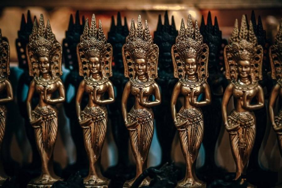 Mini golden Cambodian brass statues