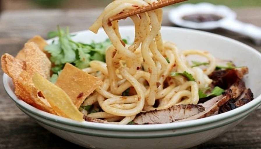 Cao Lau (Rice Noodles With Barbecued Pork, Greens and Croutons)- Tour Packages and Vacation | AOJ